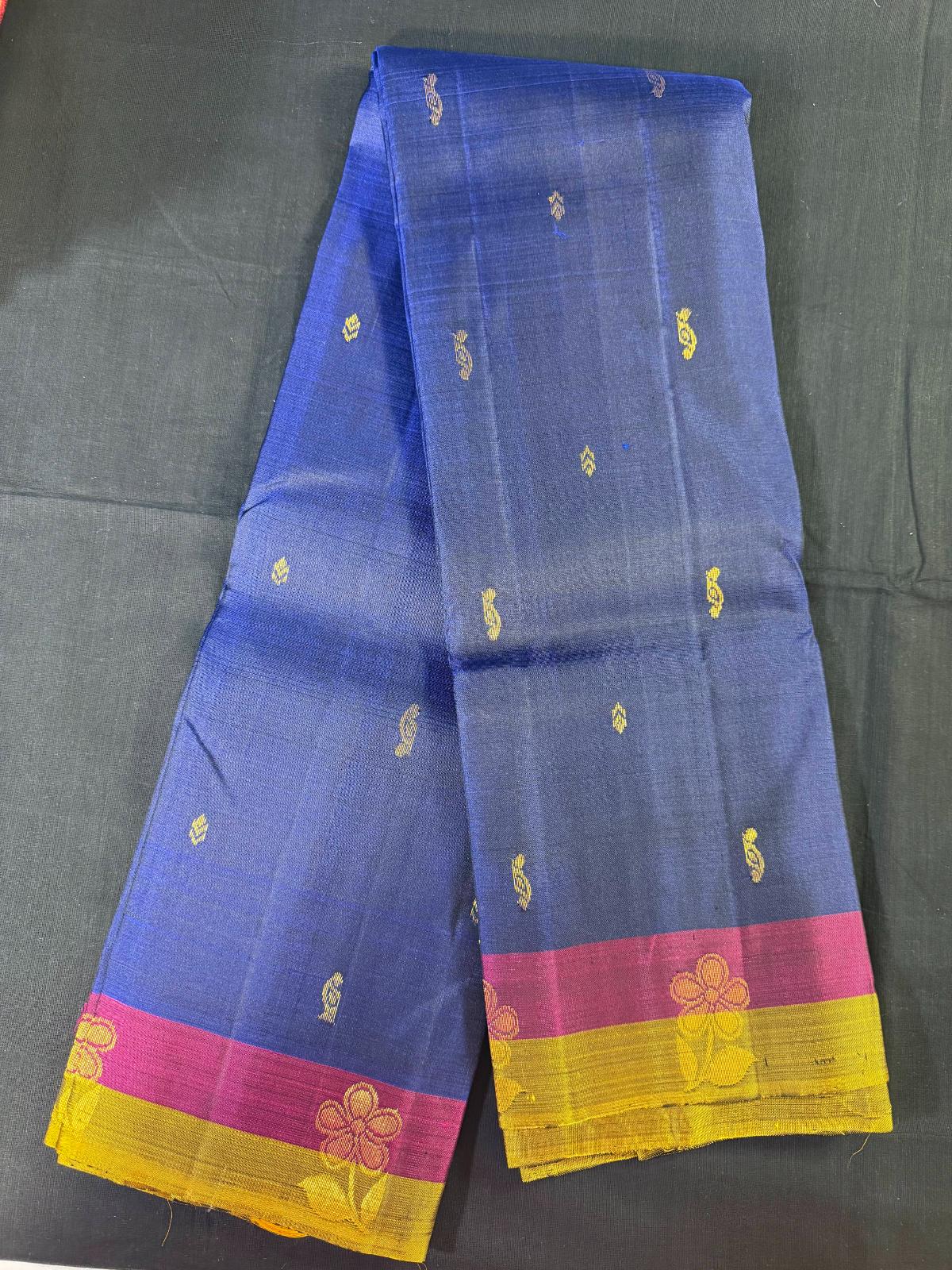 Blue Pure Kanjivaram Pattu with mango and jari butas, magenta and green border