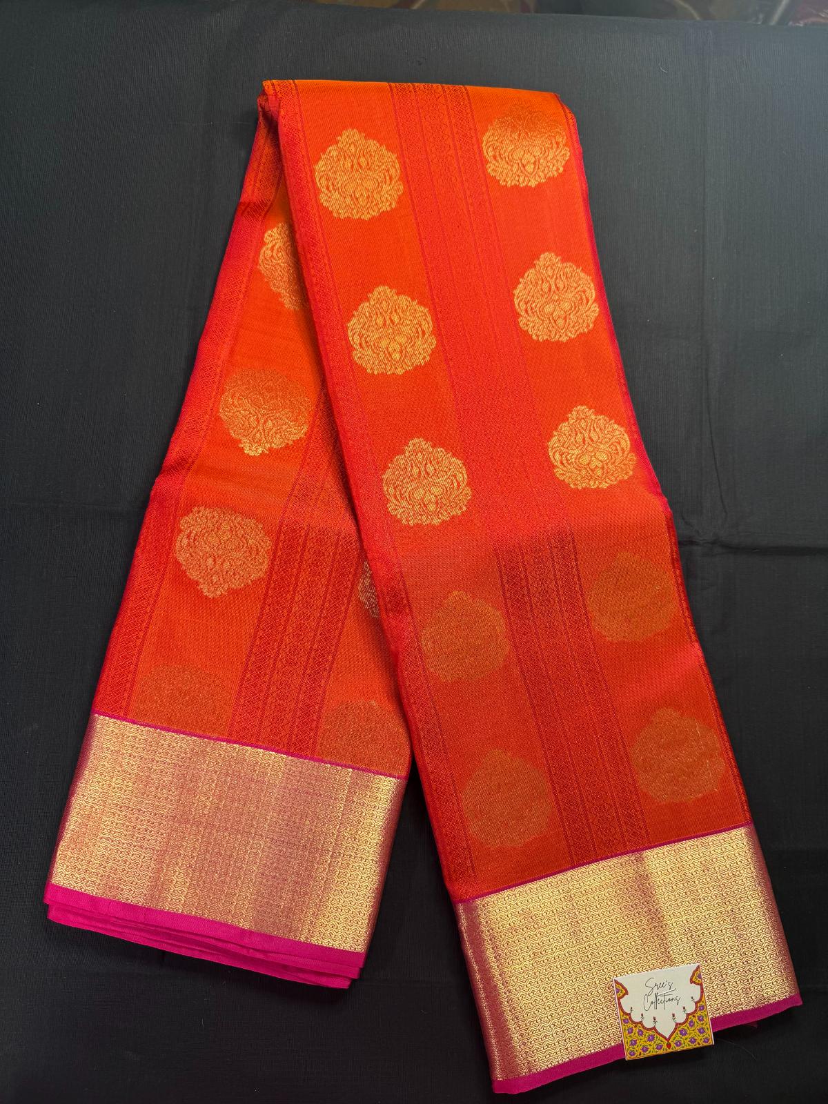 Red Pure Kanjivaram Pattu with all over pink lines and gold butas, with kadi border