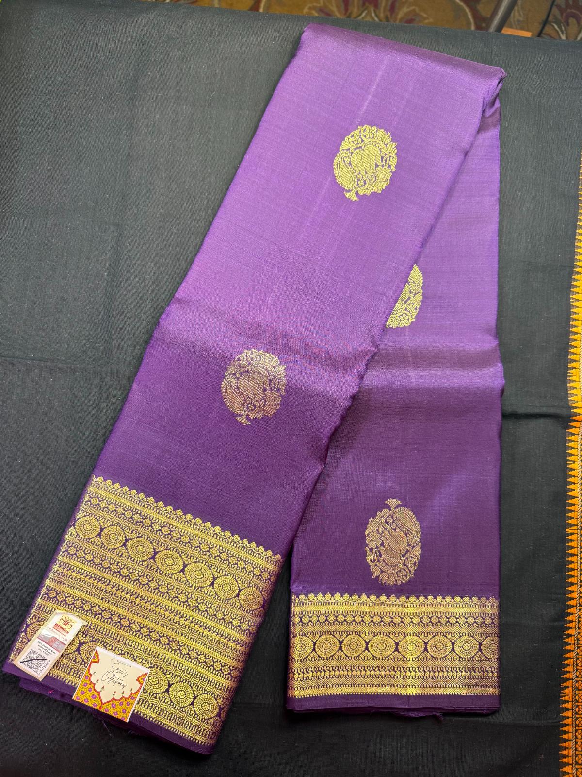 Purple pure kanjivaram pattu with jari lotus butas all over, heavy jari border with rudrakshas