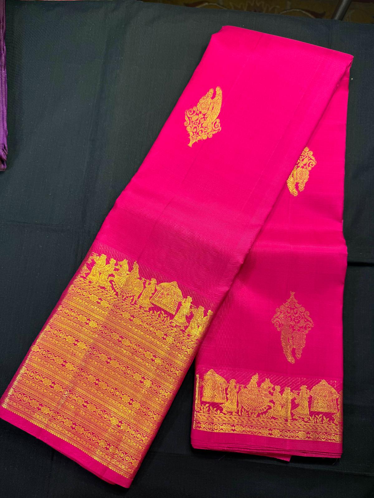 Pink pure kanjivaram pattu with all over dollsdesign, palanquin (pallaki) design and heavy gold jari border