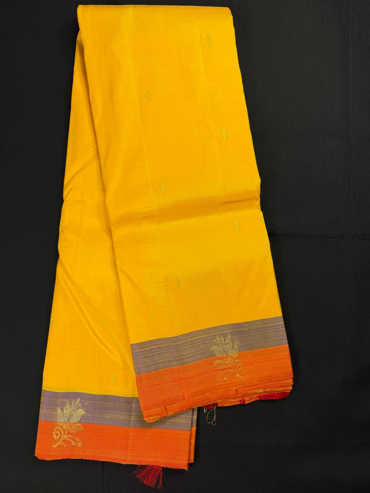 Yellow Pure Kanjivaram Pattu, Light Weight and Double Border Orange and Lavender, Flowers in Border, All Over Gold Butas