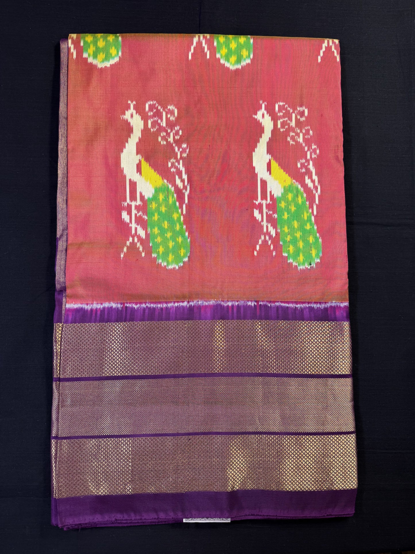 Peach Ikkat Pochampally With Big Purple Border With All Over Whole Peacock Design