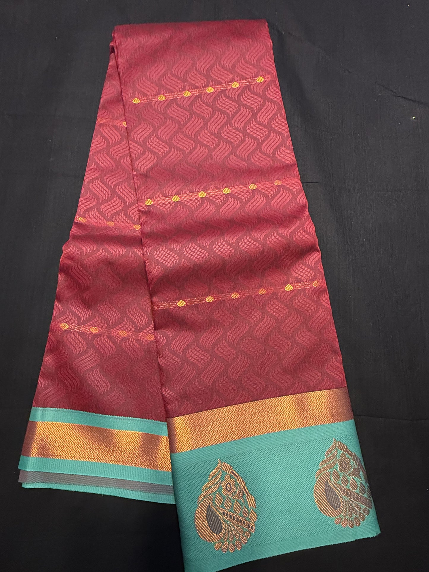 Maroon Fancy Saree, with jacquard and water drop copper jari butas all over, and kadi copper border and green border with big leaf design