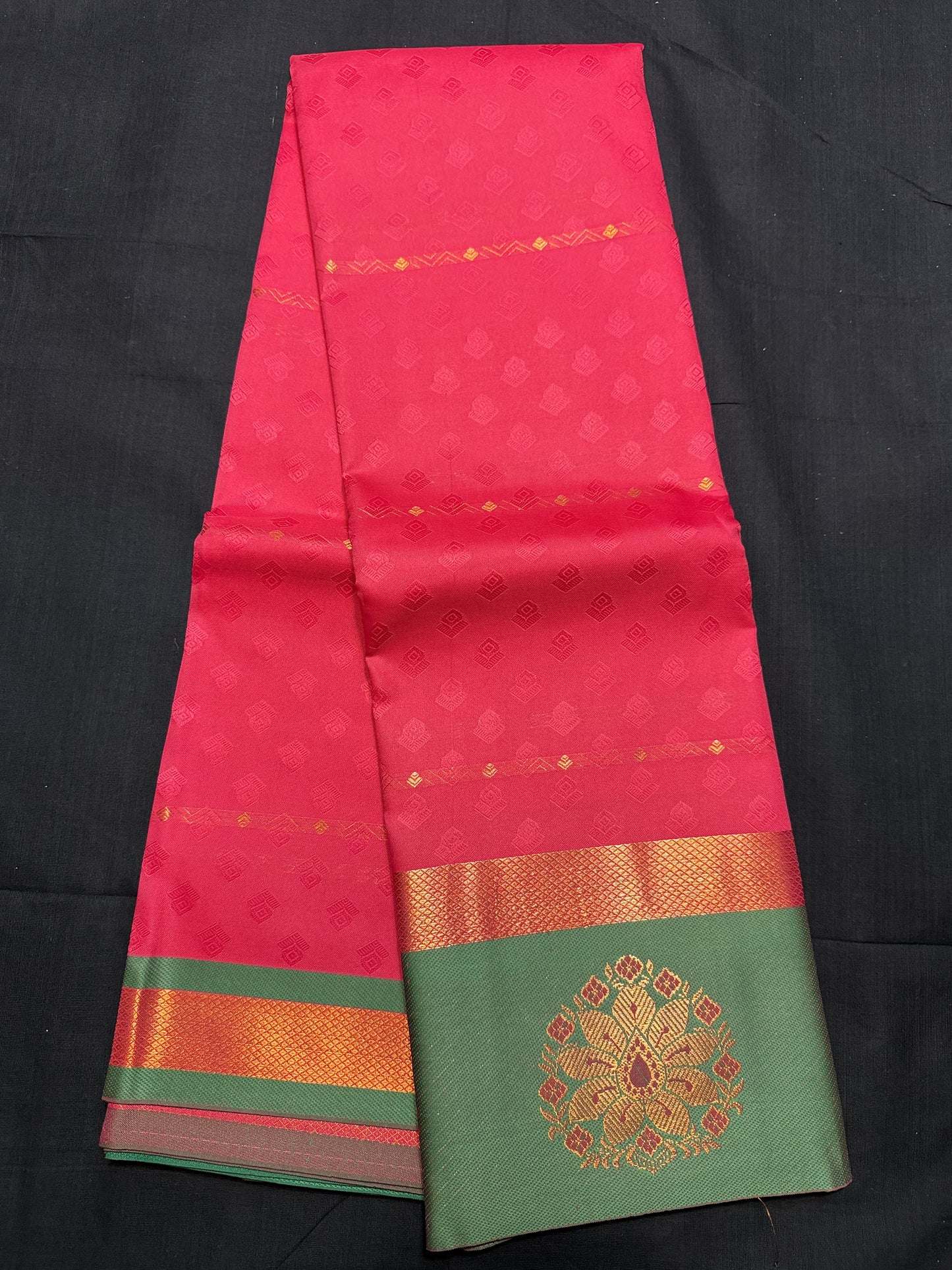 Pink Fancy Saree, with jacquard and copper butas all over, copper kadi border, green border with floral design