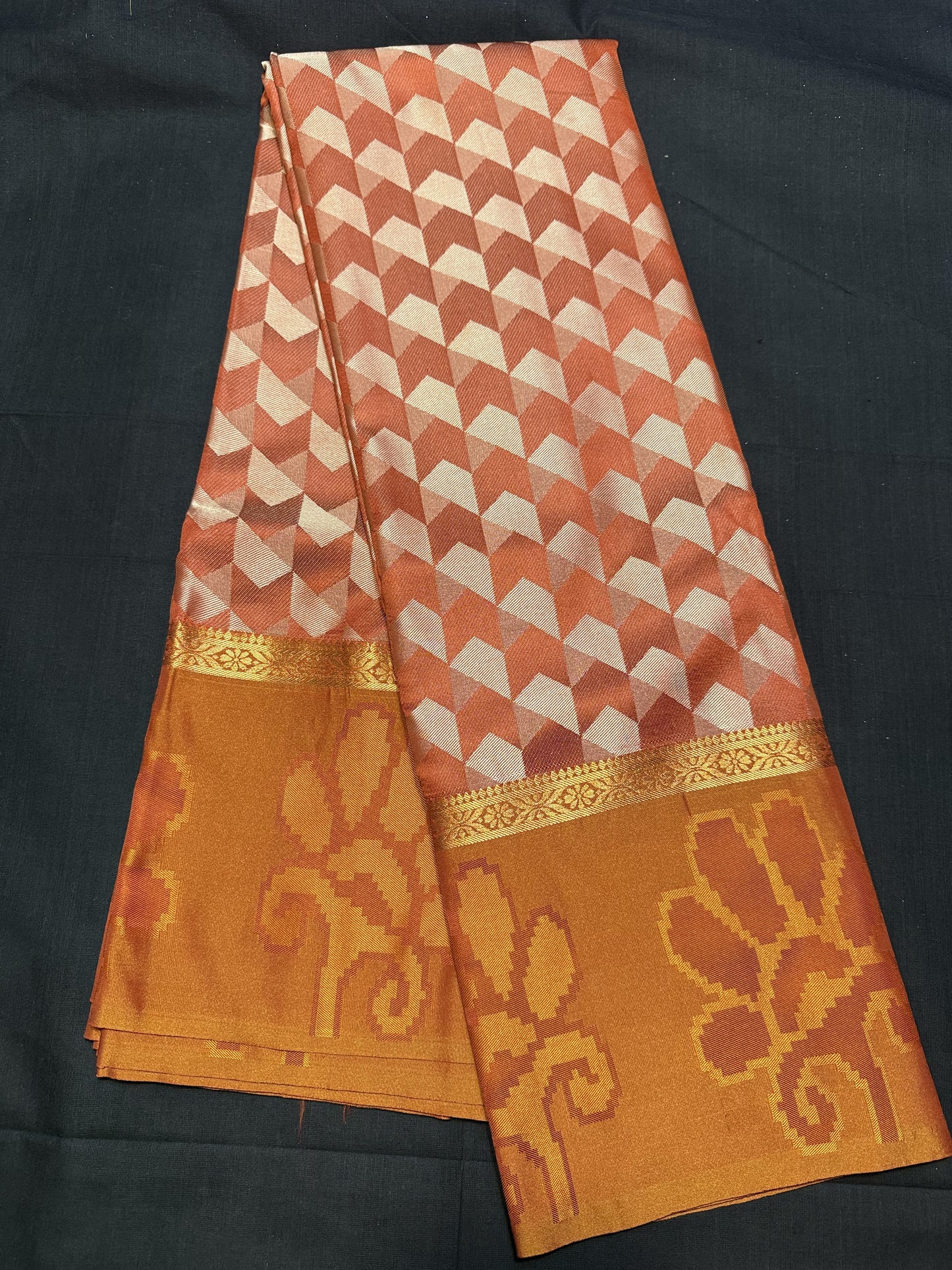 Burnt Orange Fancy Saree, with jacquard all over arrows design, kadi border and self border with floral design