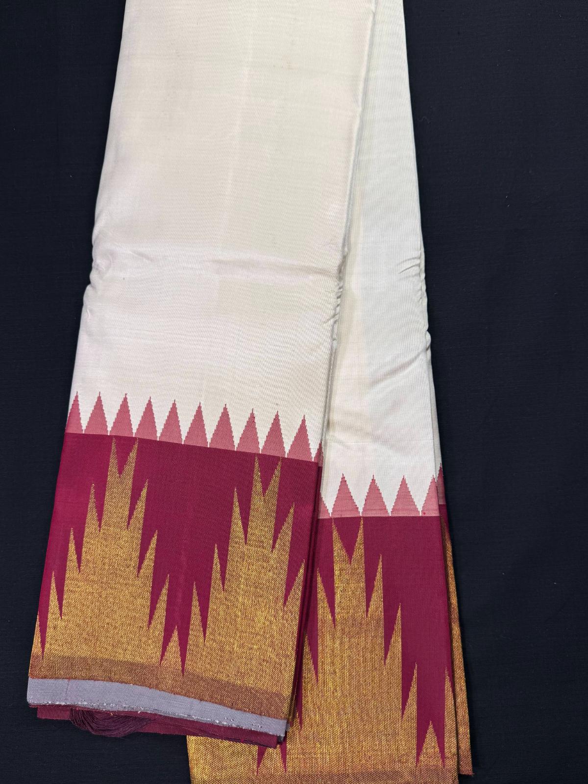 Off-white pure Kanjivaram pattu with temple border, maroon and gold temple design