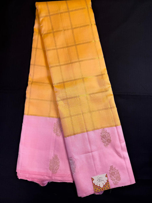 Yellow Pure Kanjivaram Pattu with big checks and Pink border with gold and silver butas