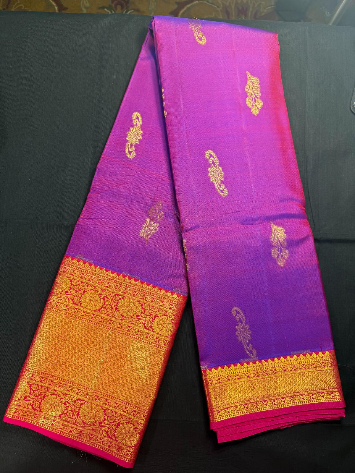Magenta Pure Kanjivaram Pattu, Red Big border, gold butas all over, flowers in border