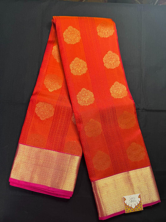Red Pure Kanjivaram Pattu with all over pink lines and gold butas, with kadi border