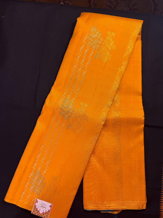 Yellow Pure Kanjivaram Pattu with jari design lines, with gold, silver and blue thread, heavy design, borderless