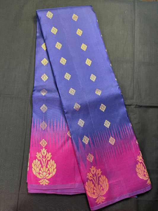 Navy blue pure and light weight Kanjivaram pattu with all over jari butas, magenta border with big butas