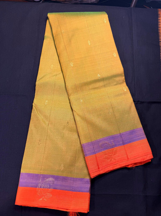 Green and Yellow mixed pure kanjivaram pattu with small butas all over, double border, purple and orange with mango butas