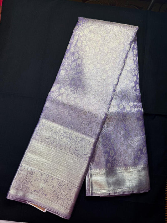 Lavendor pure kanjivaram pattu, with all silver tissue, all over jacquard and triple border with flowers, kadi and peacocks