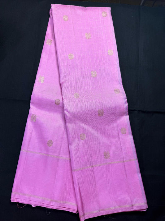 Baby pink pure kanjivaram pattu with all over checks, peacock and rudraksha butas, gap border with small jari gap border
