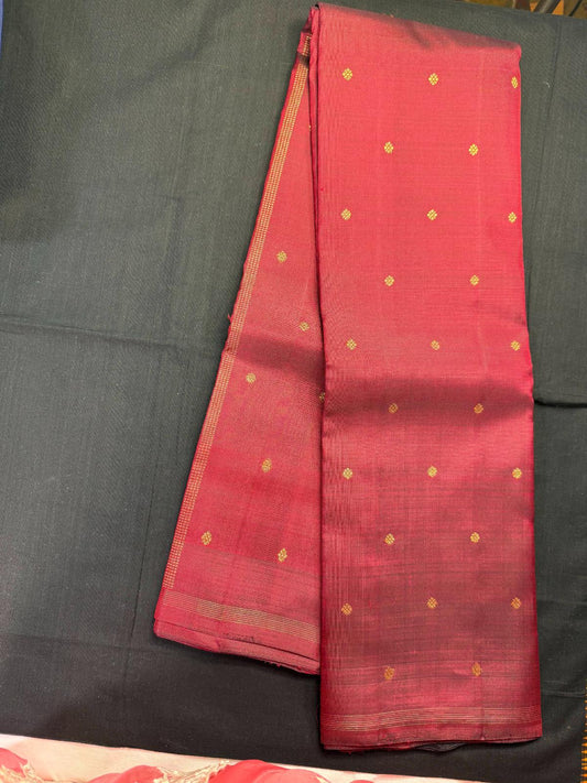Maroon pure kanjivaram pattu with jari butas all over, horizontal lines in self border