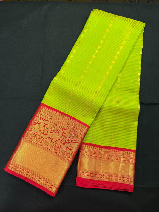 Green vaira oosi pure kanjivaram pattu with butas, double border including peacocks, rudrakshas and kadi border