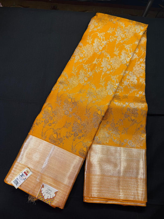 Mustard yellow pure kanjivaram pattu withall over antique jari, meenakari design with kadi border