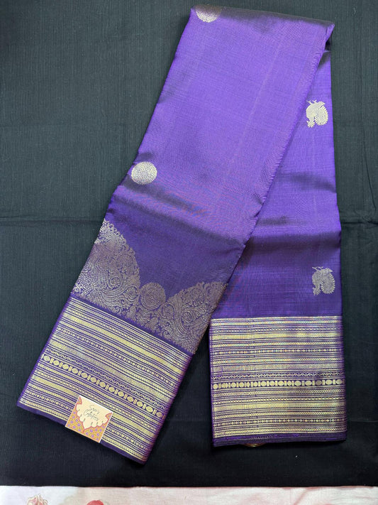 Purple pure kanjivaram pattu with crown border, rudraksha, peacock butas, heavy jari border