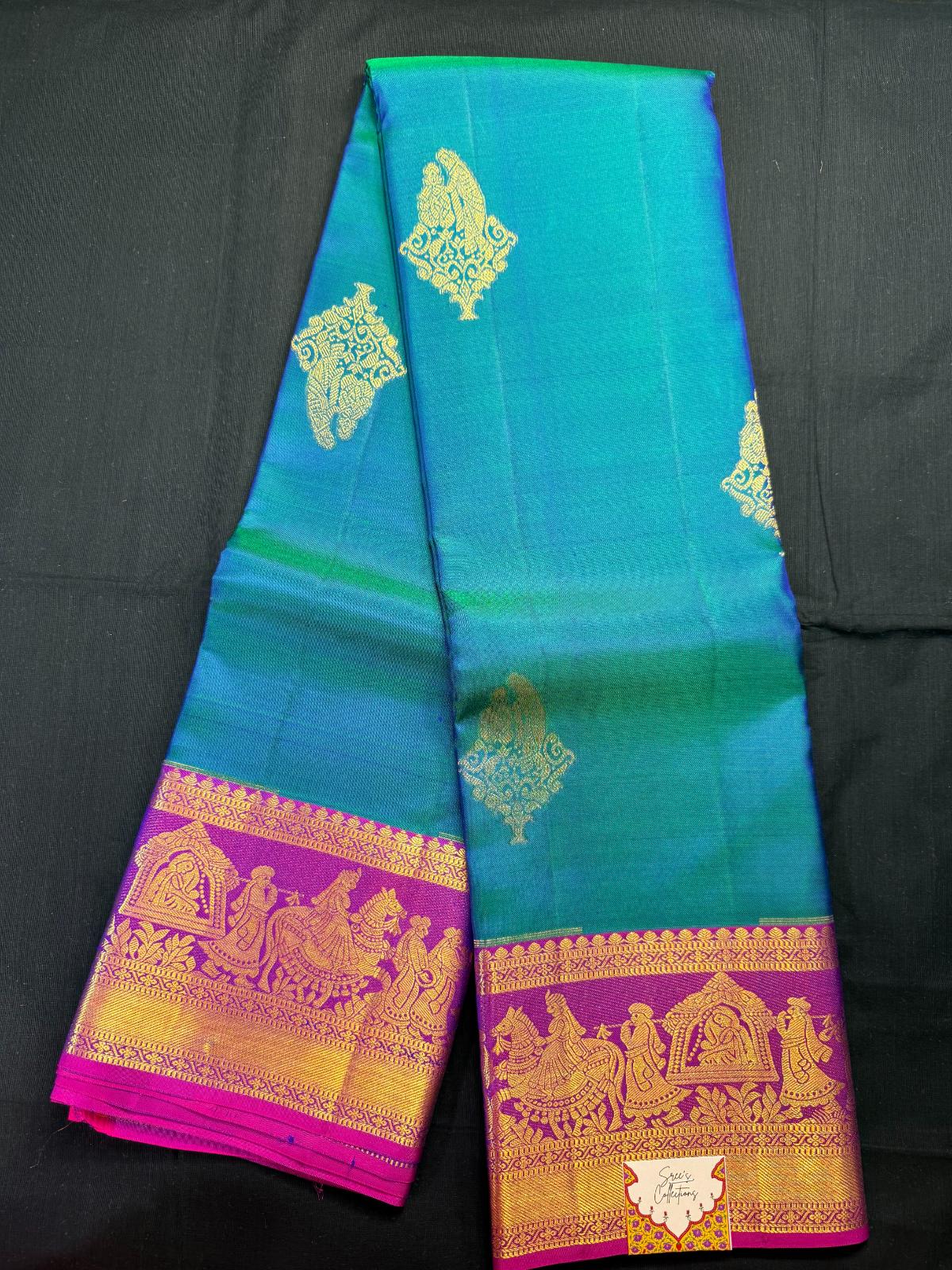 Peacock Blue pure kanjivaram pattu, with wedding butas, magenta with palanquin (pallaki) design