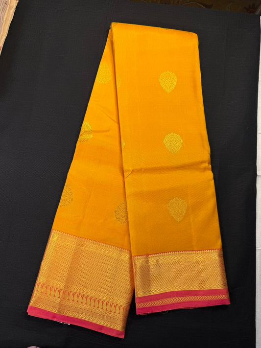 Yellow Pure Kanjivaram Pattu, With Pink Double Border, All Over Medium Size Gold Butas
