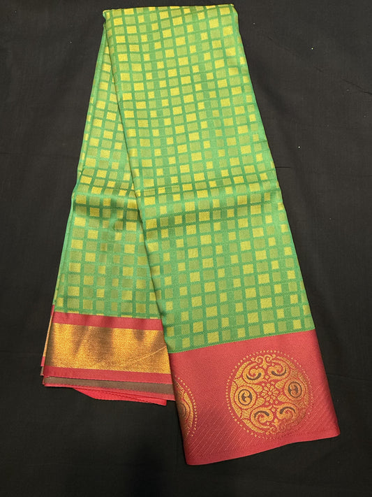 Green Fancy Saree, with jacquard and squares all over, and maroon border with big rangoli design