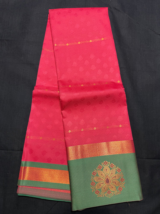 Pink Fancy Saree, with jacquard and copper butas all over, copper kadi border, green border with floral design