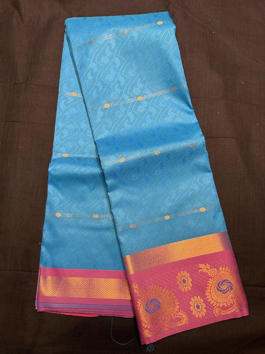 Peacock Blue Fancy Saree, with jacquard and floral copper butas all over, kadi border and Pink border with flowers and mor pankh