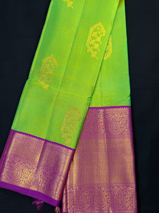 Parrot Green pure Kanjivaram pattu, gold mix, big buta design, big magenta border, heavy design