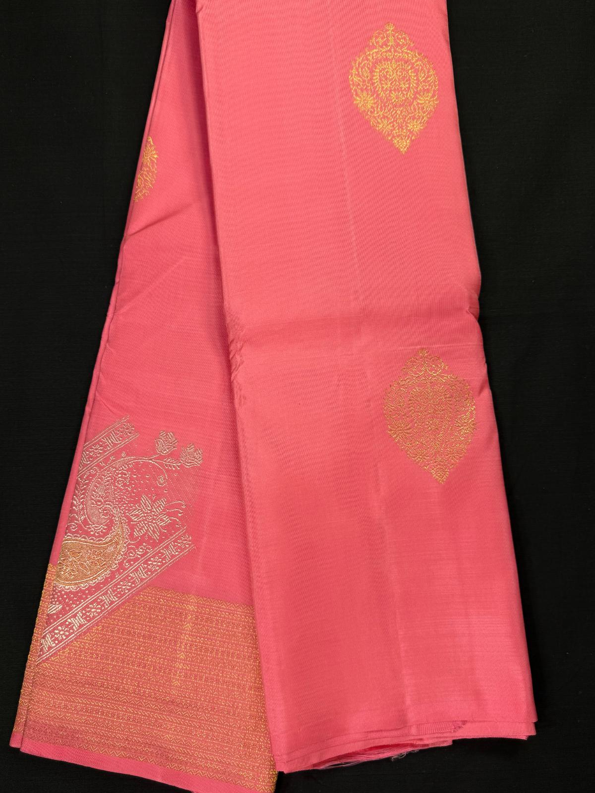 Pink pure kanjivaram pattu with gold and silver butas, corss design above self border